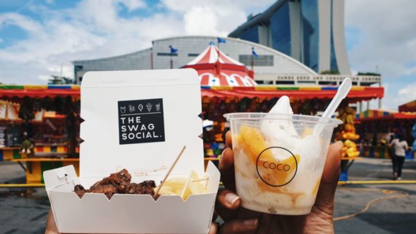 Yakitori beef skewers and coconut soft serve against the backdrop of Uncle Ringo presents The Great Circus of Europe